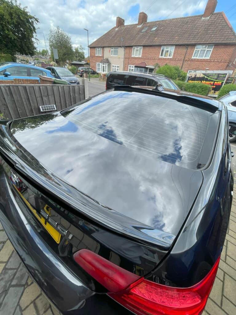 Sining, clean rear glass on a bmw 3 series with ceramic coating properties done by Elite AutoCare