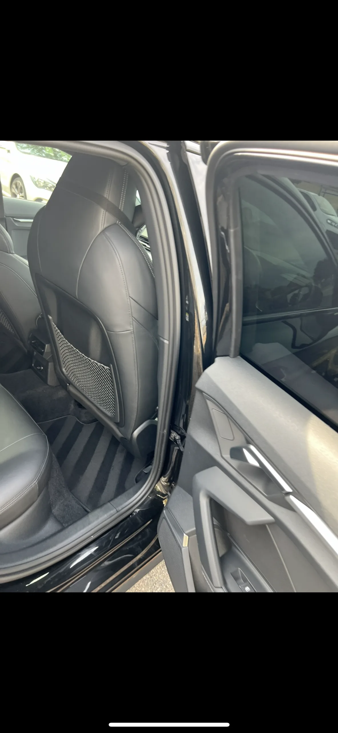 Rear seats of an Audi S3 with carpet lines in Croydon