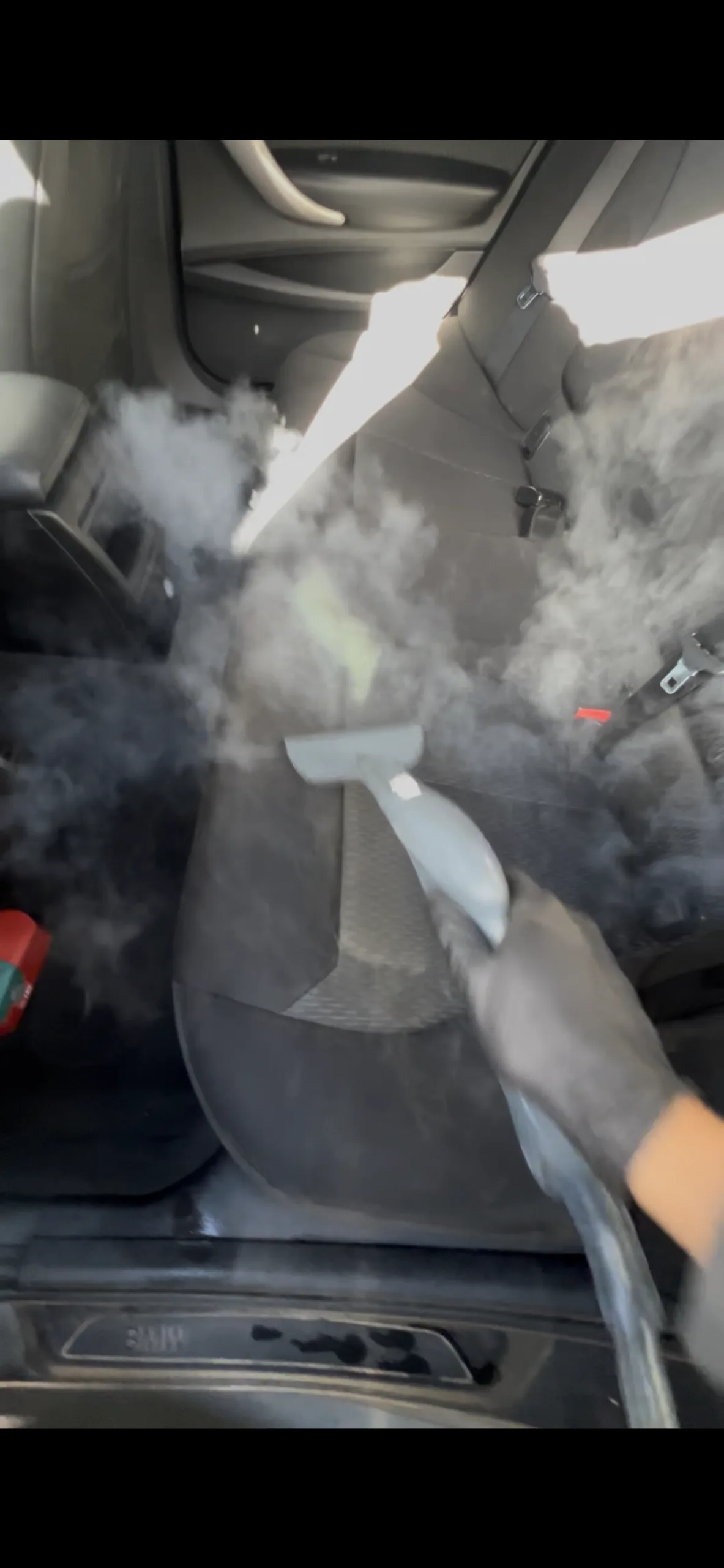 Odour removal service being performed with steam to sanitise a car interior in Croydon